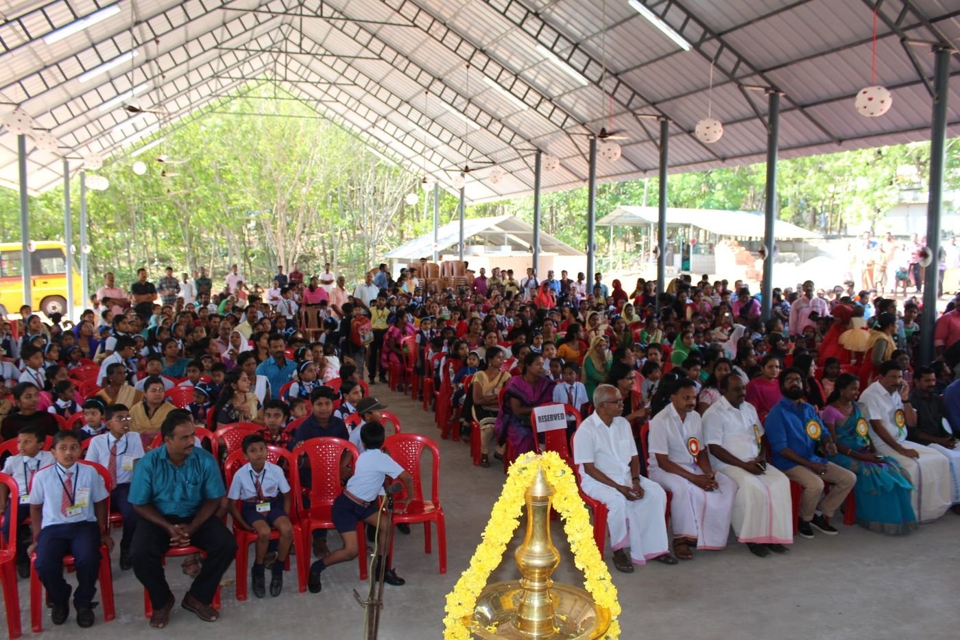 The whole school gathered under the assembly shed